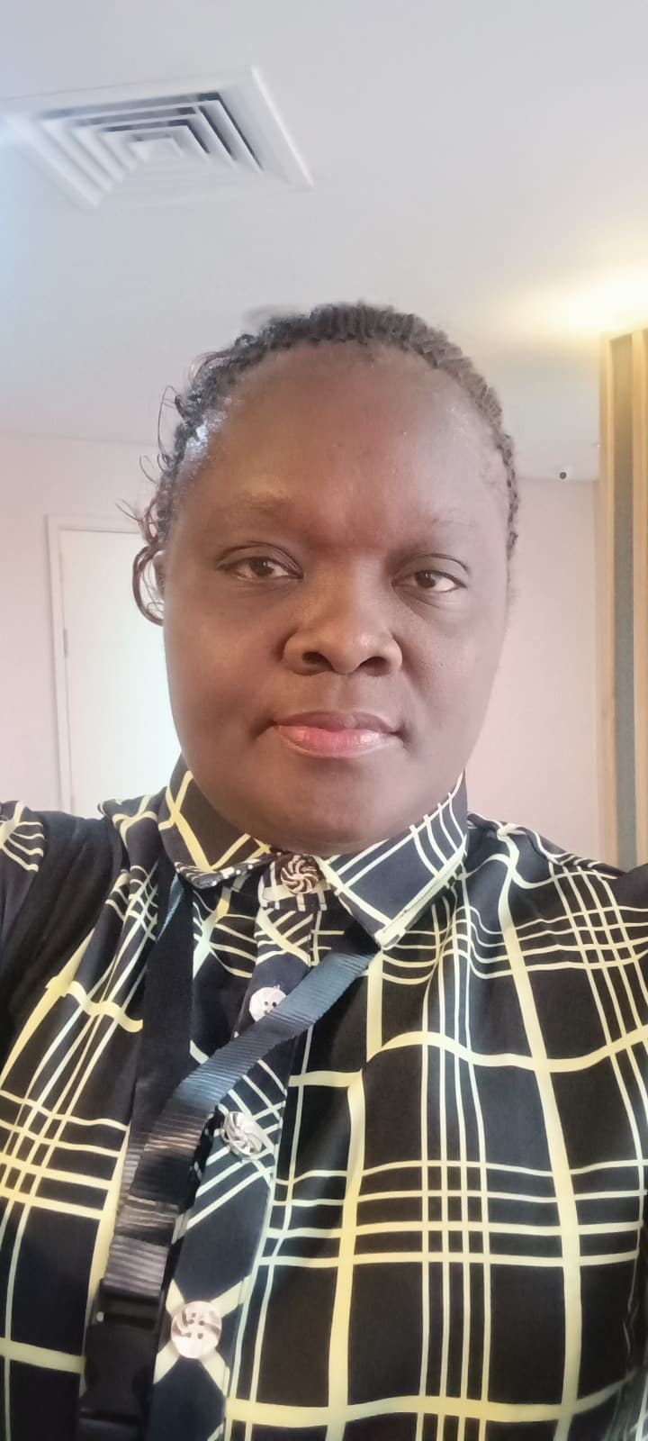 Portrait of Dr. Caren Adhiambo Otieno of CHAKE.